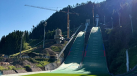 Olimpiadi 2026, inaugurato il trampolino di Predazzo, opera finanziata anche dal MIT con 10 milioni di euro